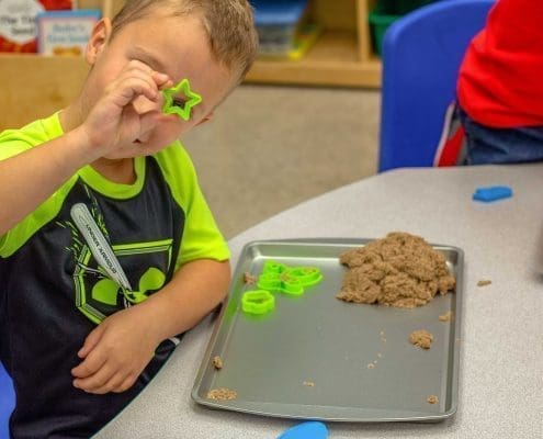 Children practicing grace and courtesy lessons, learning to interact respectfully in a Montessori environment.