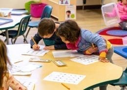 Montessori art corner where children explore colors and textures with paints and clay.